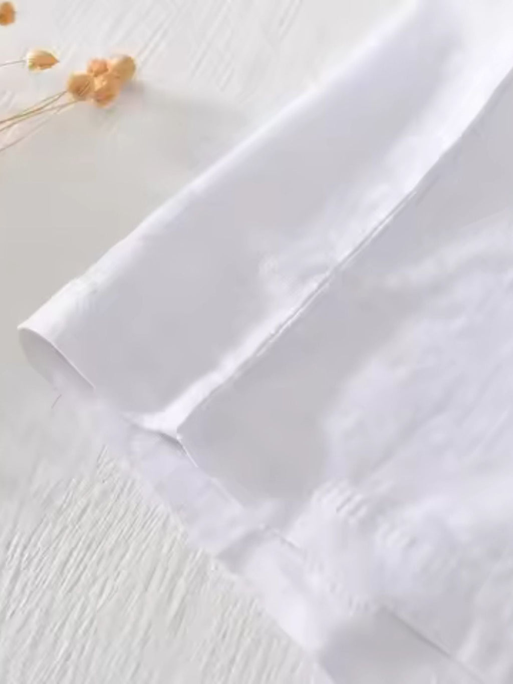 Premium traditionally stitched hem of sea green white Swiss linen shirt